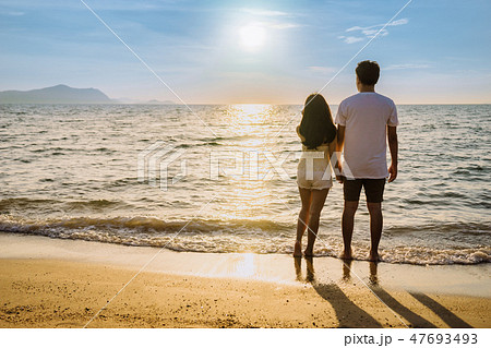 Asian couple are happy with love on the beach 47693493