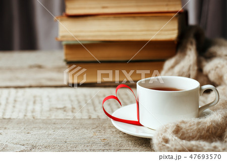 Old vintage books and cup with heart shape Old vintage books and cup with heart shape 47693570