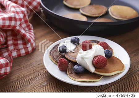 pancakes with berries on a plate pancakes with berries on a plate 47694708