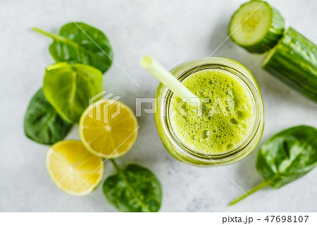 Green healthy smoothie in the jar, top view 47698107