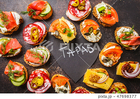 Assorted spanish tapas with fish, sausage, cheese 47698377