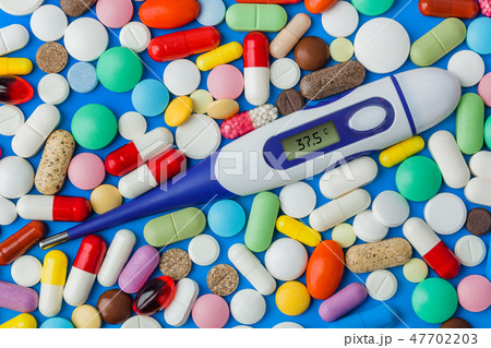 Pills and electronic thermometer 47702203