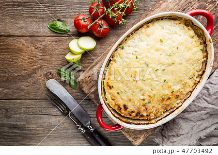 Casserole with chicken and zucchini Casserole with chicken and zucchini 47703492