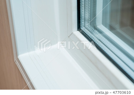 Photo of a white window sill 47703610