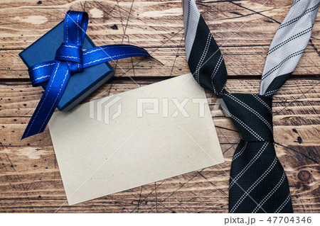 Father's Day Concept. Striped tie and a gift  47704346