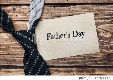 Father's Day Concept. Striped tie on wooden  47704347