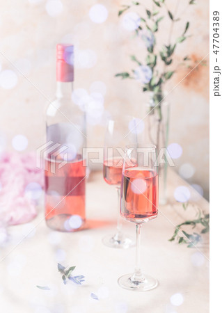 Two glasses and bottle of rose wine 47704389