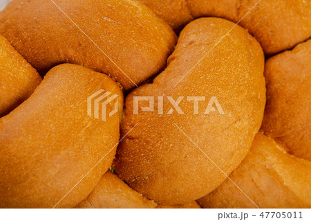 Freshly baked bread on a wooden background. Freshly baked bread on a wooden background. 47705011