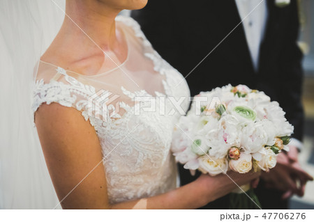 Wedding couple bide and groom get married in a church Wedding couple bide and groom get married in a church 47706276