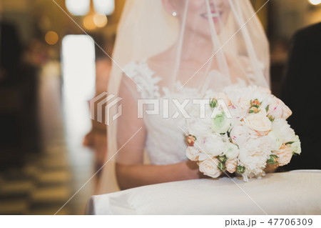 Wedding couple bide and groom get married in a church Wedding couple bide and groom get married in a church 47706309