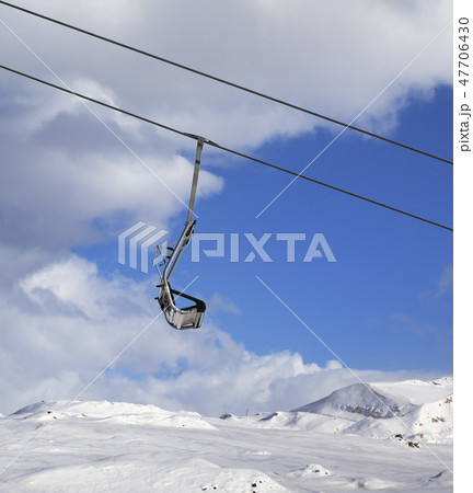 Snow slope, chairlift and sky with cloud at winter Snow slope, chairlift and sky with cloud at winter 47706430