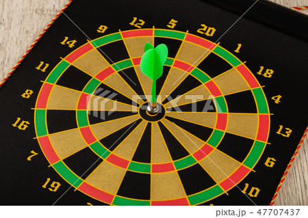 The game of darts, darts on the target. The game of darts, darts on the target. 47707437