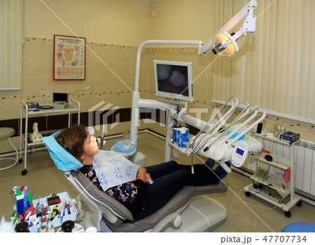 The woman in a stomatologic chair 47707734