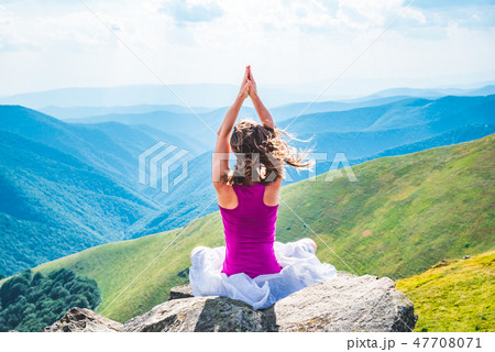 Young woman on the top of mountain Young woman on the top of mountain 47708071