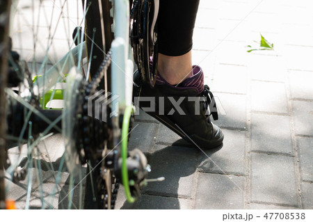 Legs cyclist on vacation after a long trip. Legs cyclist on vacation after a long trip. 47708538