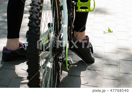 Legs cyclist on vacation after a long trip. Legs cyclist on vacation after a long trip. 47708540