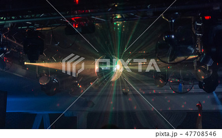 Mirror ball in a nightclub with different lights. 47708546