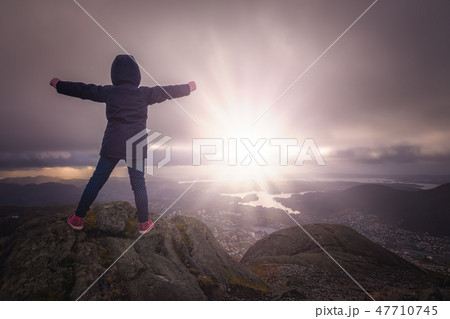 Young girl on top of the Mount Ulriken Young girl on top of the Mount Ulriken 47710745