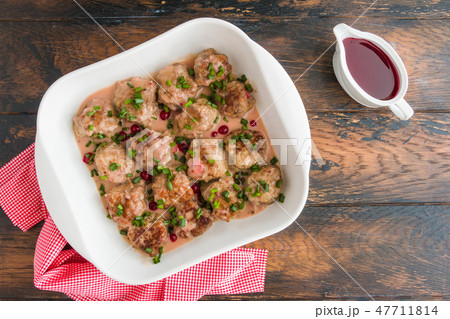 Swedish meatballs in a red cowberry sauce Swedish meatballs in a red cowberry sauce 47711814