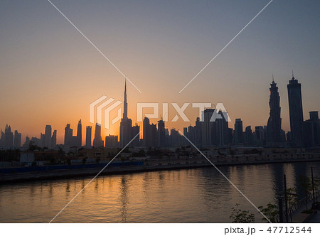 Panorama of the city of Dubai early in the morning at sunrise with a bridge over the city channel Panorama of the city of Dubai early in the morning at sunrise with a bridge over the city channel 47712544