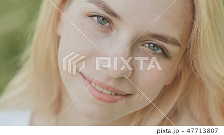 Close-up face of a smiling 19 year old blonde girl. Close-up face of a smiling 19 year old blonde girl. 47713807