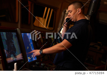 Navigation officer. Pilot on a bridge of a vessel Navigation officer. Pilot on a bridge of a vessel 47715094