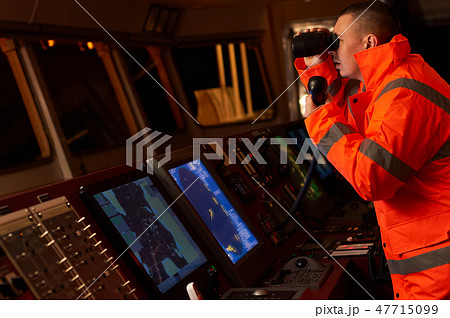 Navigation officer. Pilot on a bridge of a vessel Navigation officer. Pilot on a bridge of a vessel 47715099