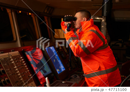 Navigation officer. Pilot on a bridge of a vessel Navigation officer. Pilot on a bridge of a vessel 47715100