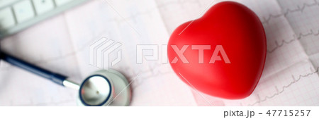 Medical stethoscope head and red toy heart Medical stethoscope head and red toy heart 47715257