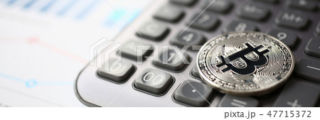 Coin crypto currency bitcoin lies on the keyboard Coin crypto currency bitcoin lies on the keyboard 47715372