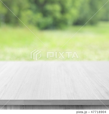 wooden table top on green bokeh background wooden table top on green bokeh background 47718904