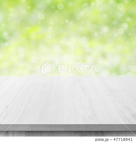 wooden table top on green bokeh background wooden table top on green bokeh background 47718941