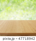 wooden table top on green bokeh background 47718942