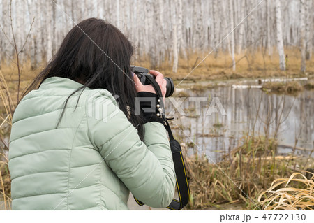 girl taking pictures of nature girl taking pictures of nature 47722130