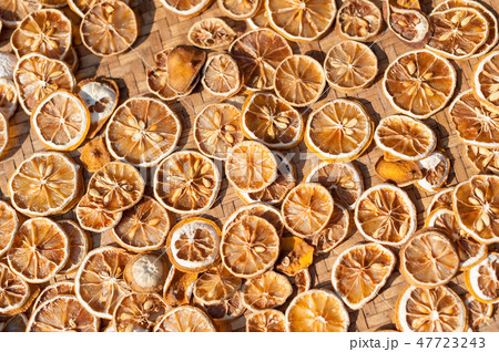 Dried lemon slices in the sun light Dried lemon slices in the sun light 47723243