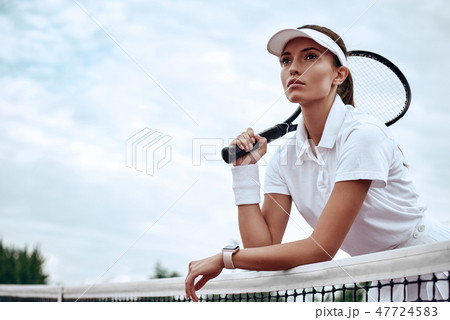 You can't win unless you learn how to lose. Portrait of young beautiful tennis player with a racket 47724583