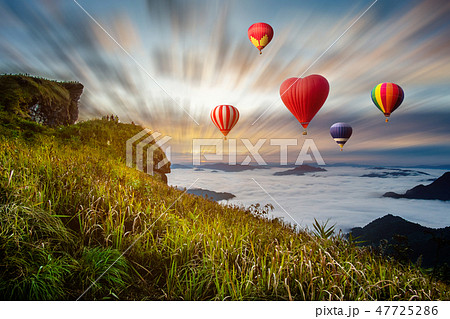 Colourful hotair balloons flying over the mountain 47725286