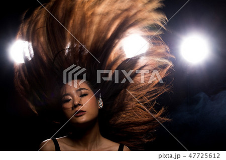 Fashion Asian Woman dark smoke back rim light 47725612