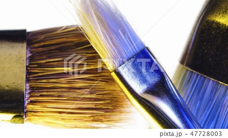 Paint brushes on white background macro 47728003