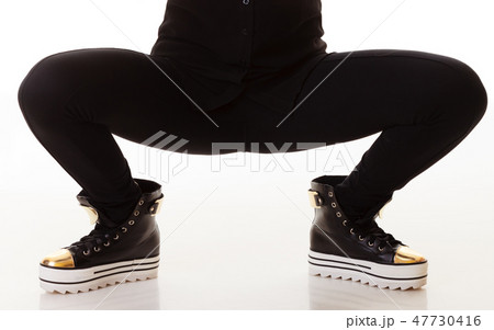 Teen fashion. Female legs in sneakers Teen fashion. Female legs in sneakers 47730416