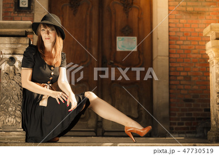 Retro style fashion woman in old town 47730519