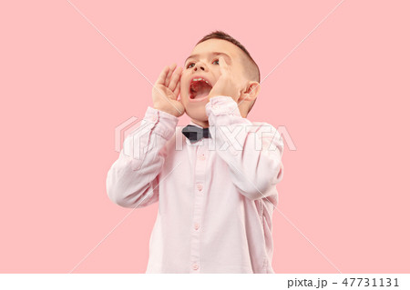 Isolated on pink young casual boy shouting at studio Isolated on pink young casual boy shouting at studio 47731131