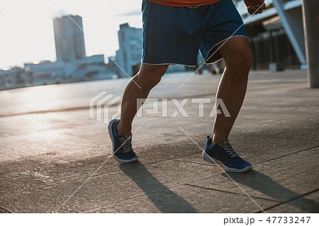 Male feet in modern shoes for sport 47733247