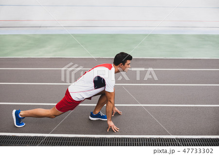 Orderly male preparing for running during workout 47733302