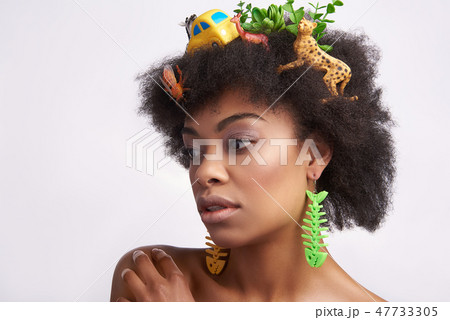 Sensual young ethnic lady with animals hairstyle Sensual young ethnic lady with animals hairstyle 47733305