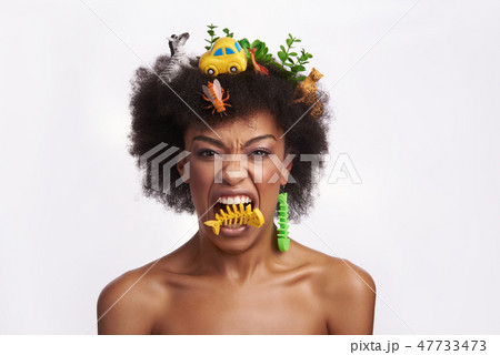 Aggressive lady pretend to eat fish bones earring Aggressive lady pretend to eat fish bones earring 47733473