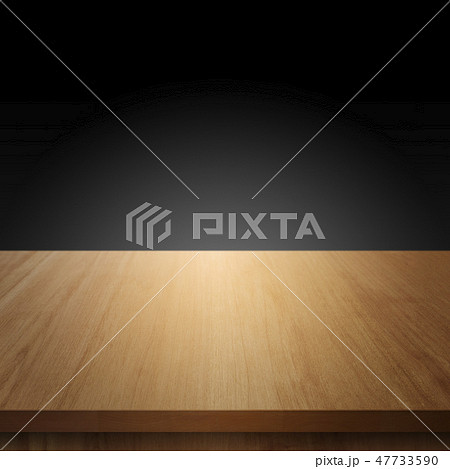 Wood table with black wall background 47733590