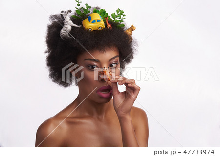 Shocked ethnic lady with bee on her nose Shocked ethnic lady with bee on her nose 47733974