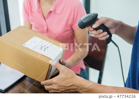 Courier hands Business woman work at home office checking parcel Courier hands Business woman work at home office checking parcel 47734216