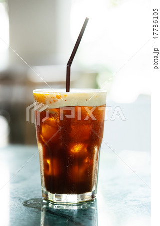 Iced coffee drink with orange slice Iced coffee drink with orange slice 47736105